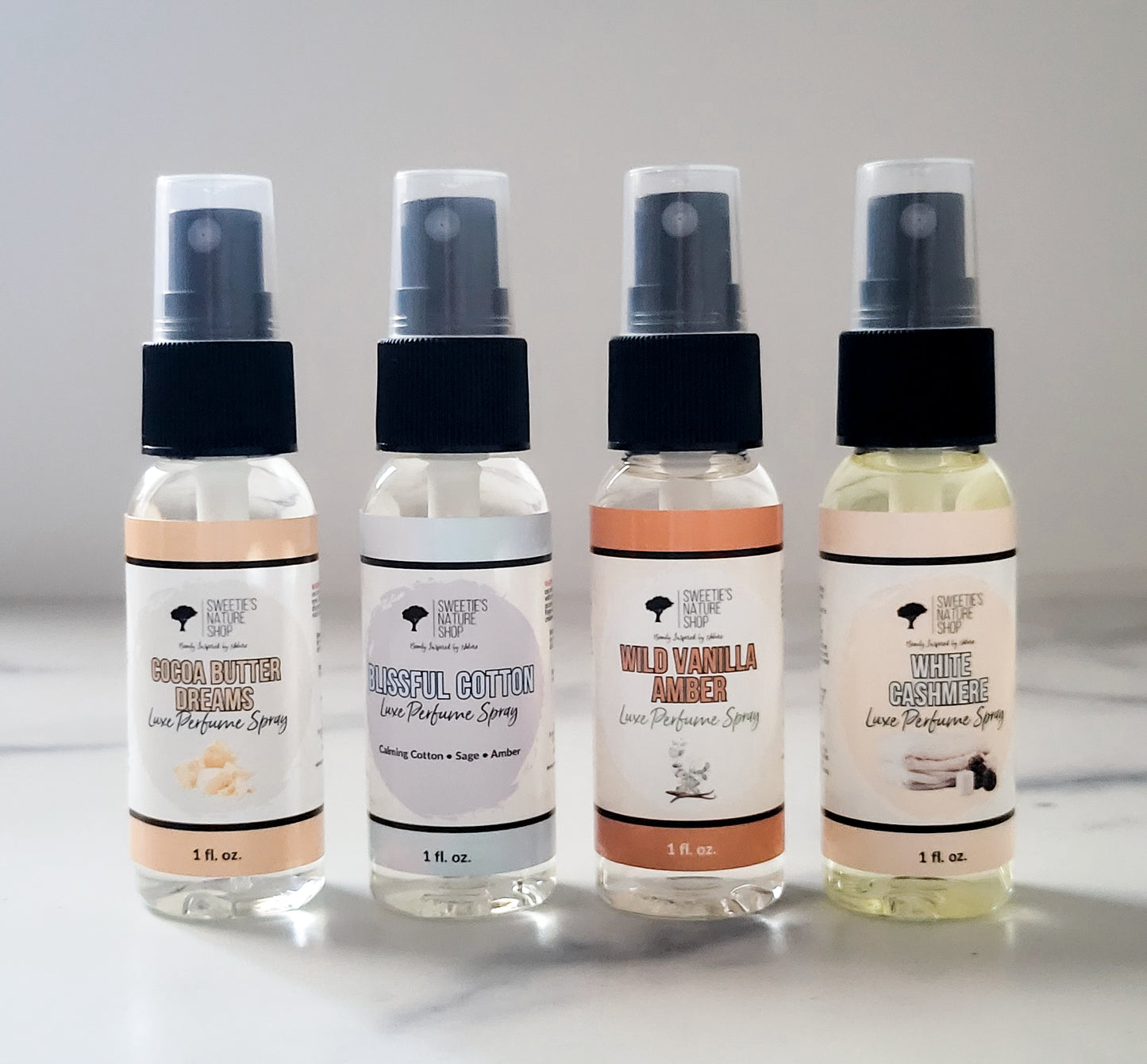 Four small perfume sprays