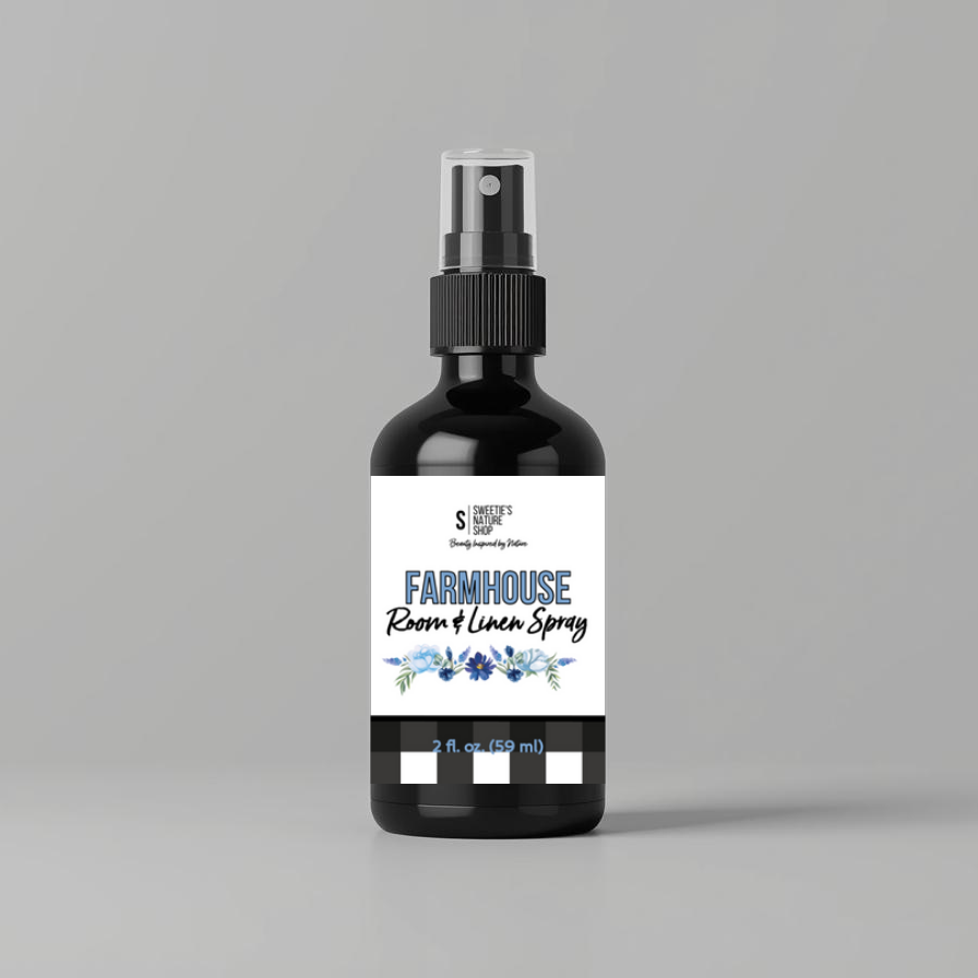 Bottle of Farmhouse Room & Linen Spray on a gray background