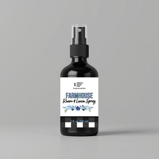Bottle of Farmhouse Room & Linen Spray on a gray background