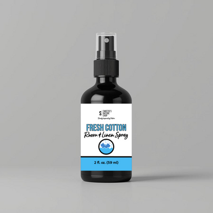 Bottle of Fresh Cotton Room & Linen Spray on a gray background