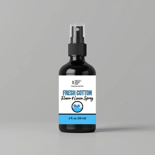Bottle of Fresh Cotton Room & Linen Spray on a gray background