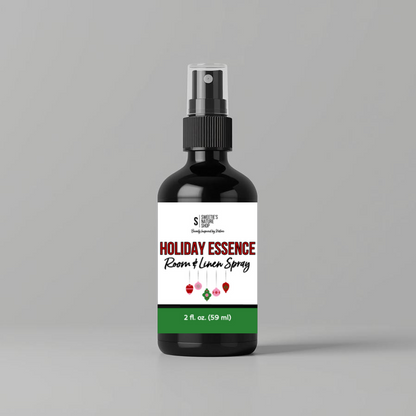 Bottle of 'Holiday Essence' room & linen spray on a gray background