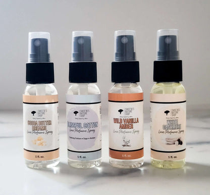 Four small perfume sprays 