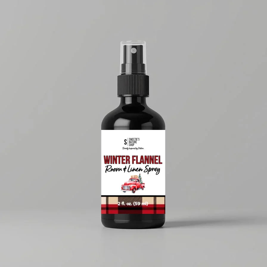 Bottle of 'Winter Flannel Room & Linen Spray' on a gray background