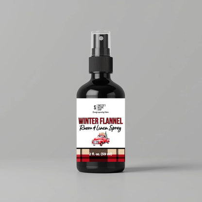 Bottle of 'Winter Flannel Room & Linen Spray' on a gray background